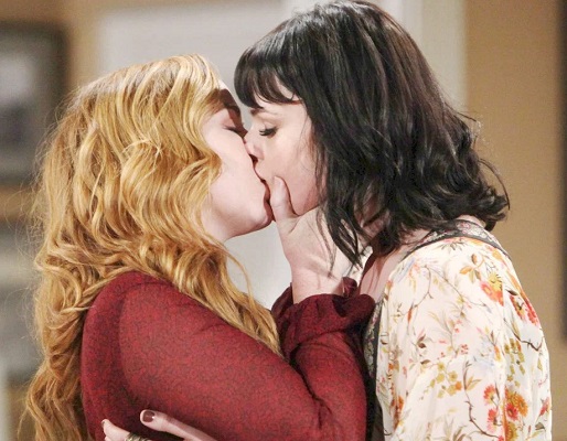 Mariah and Tessa kissing.