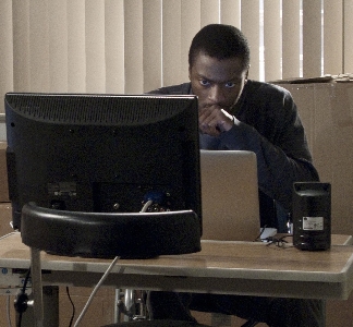 Hardison (Aldis Hodge) working on his computer