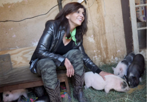 Jane Velez-Mitchell with piglets
